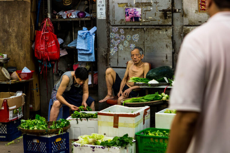 Un marché à Hong-Kong - Vendeur de légumes